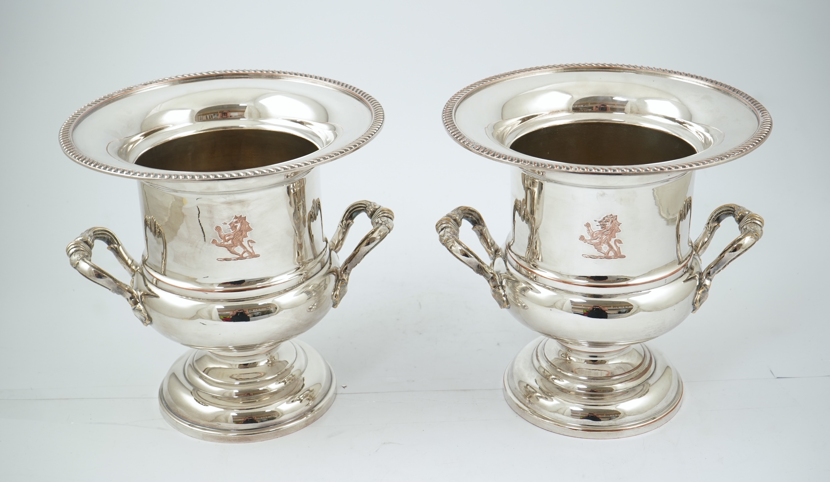 A pair of late 19th/early 20th century silver plated two handled campana shaped wine coolers, makers, FH